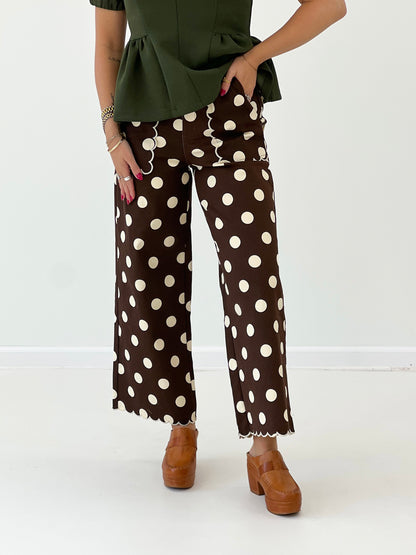 Brown polka dot wide-leg pants with scalloped hem
