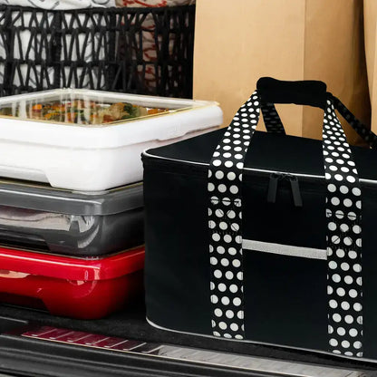 Black insulated tote with polka-dot shoulder straps and front drawstring pocket