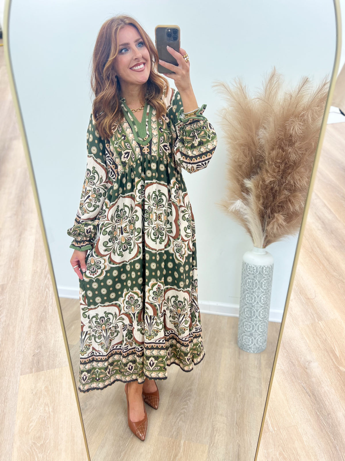 Abstract print midi dress with contrast trim, V-neck, and long sleeves