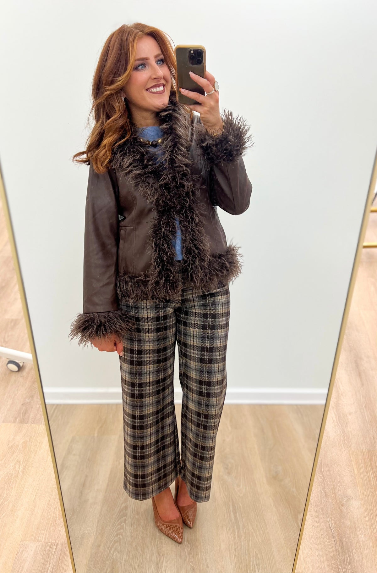 Dark faux fur-trim vegan leather jacket with fluffy collar and wide fuzzy cuffs