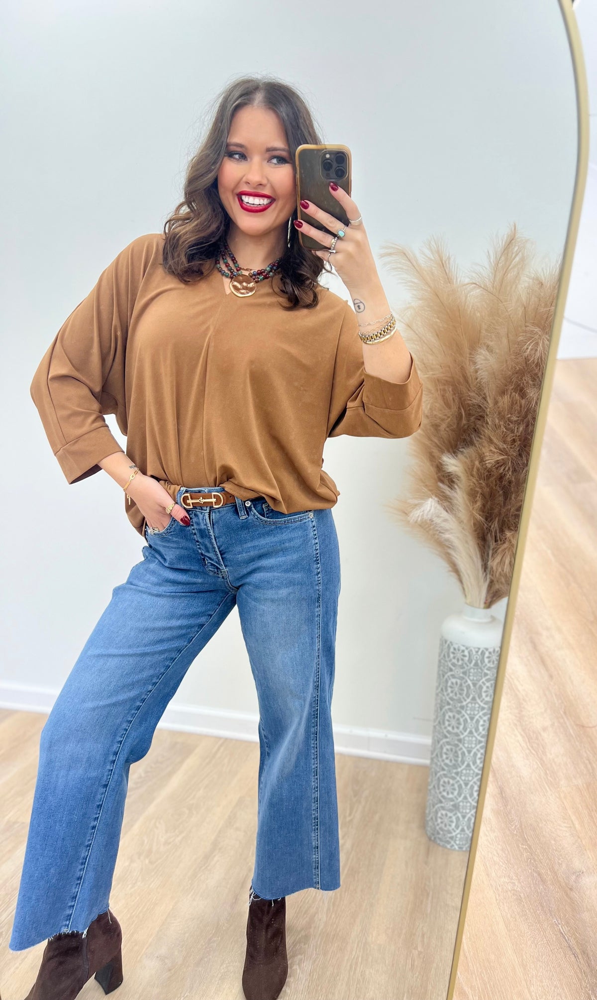 V-neck quarter-sleeve top in brown with relaxed fit and V-neckline