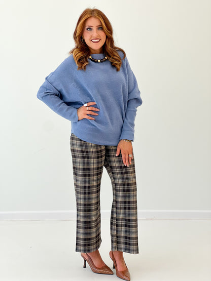 Blue boat-neck knit sweater top with long sleeves, relaxed side pose
