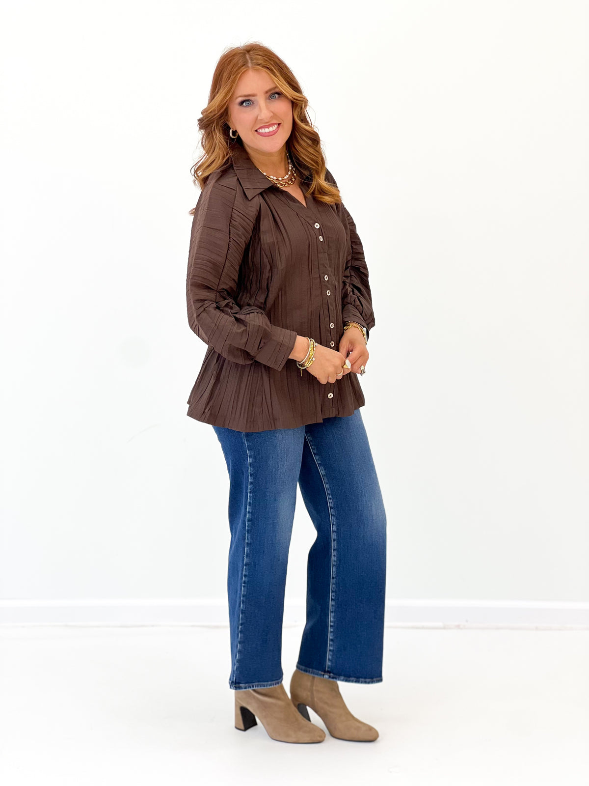 Brown ruched button-up V-neck top with front buttons and long puff sleeves
