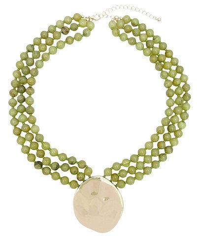 Layered bead strands finished with a pendant