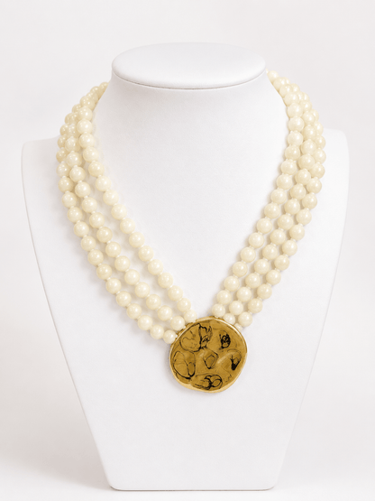 Triple-layer bead necklace with gold accents