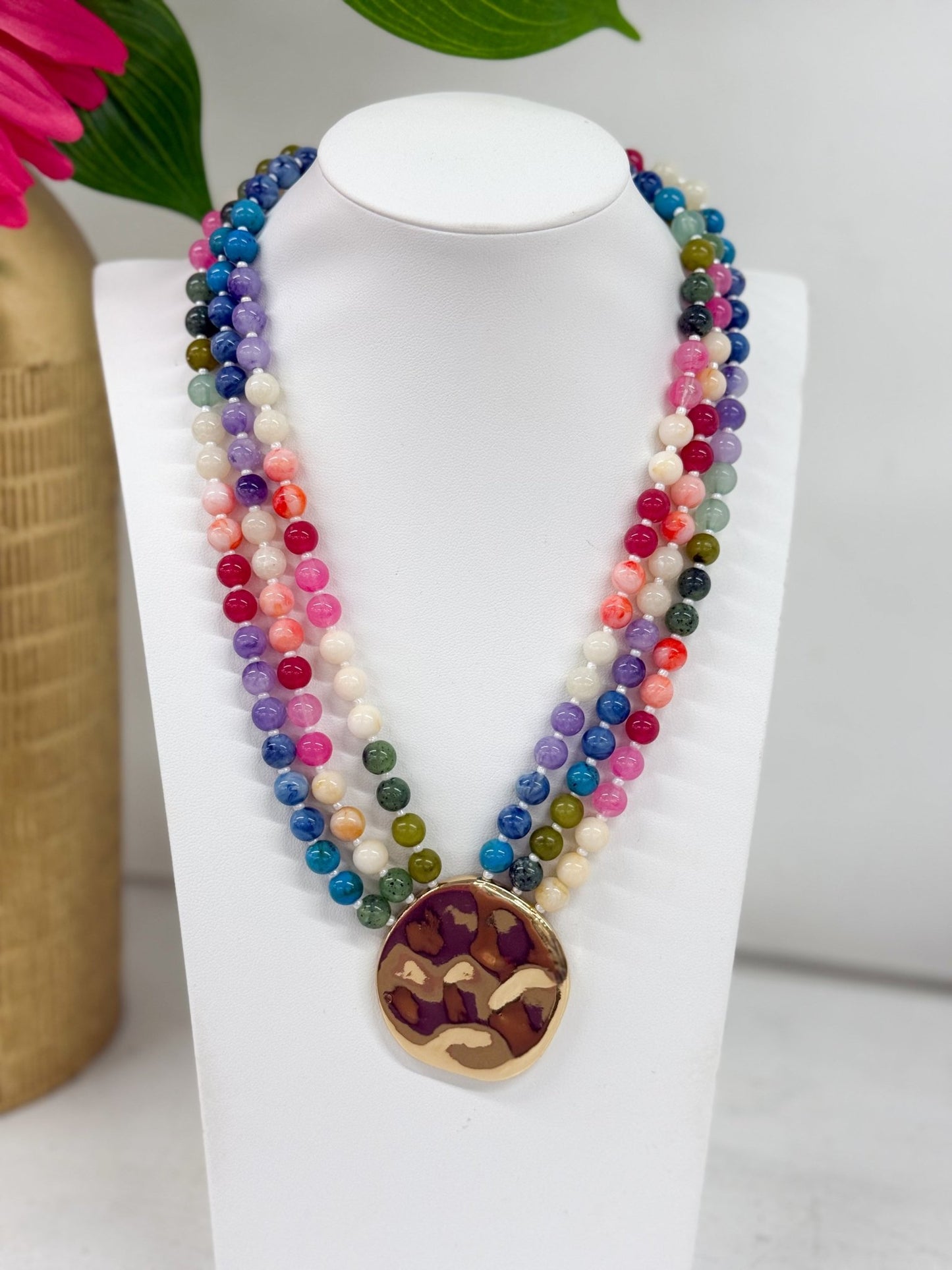 Layered bead necklace with graduated chain lengths