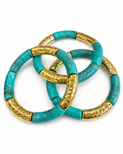 Three rows of marble beads with metallic accents