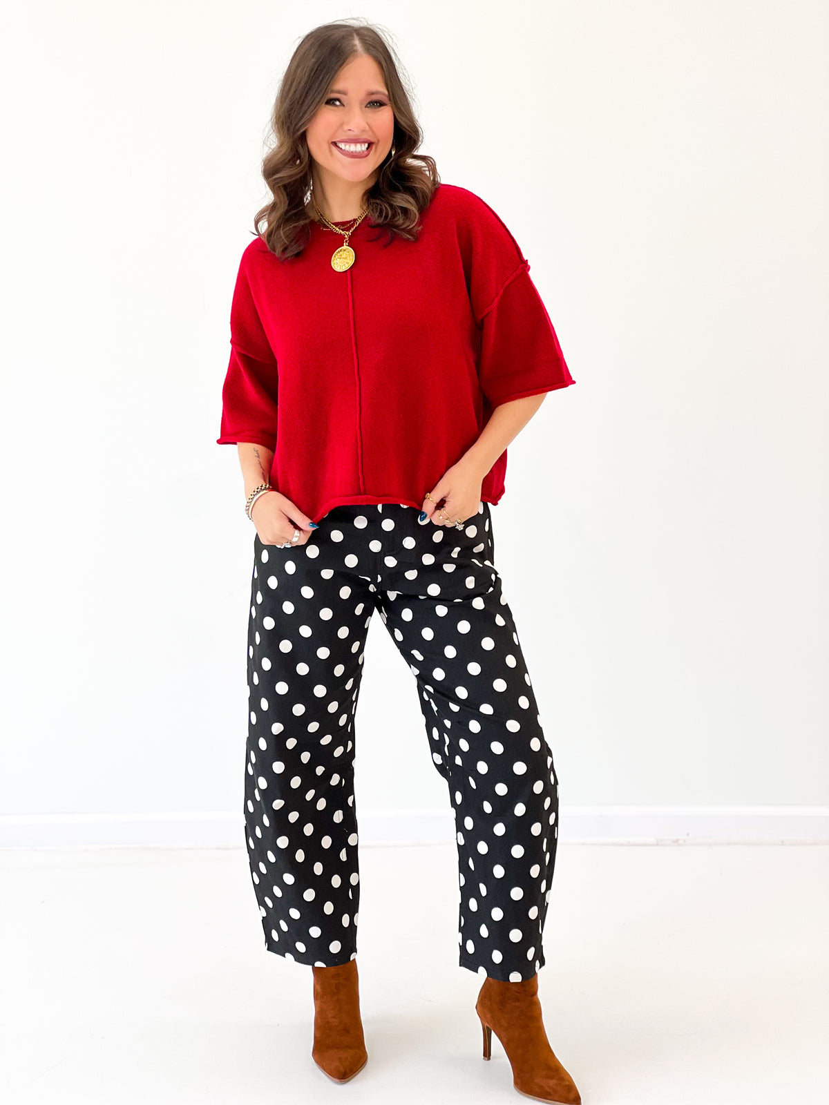 Red crewneck short-sleeve sweater with relaxed fit and draped side hem.