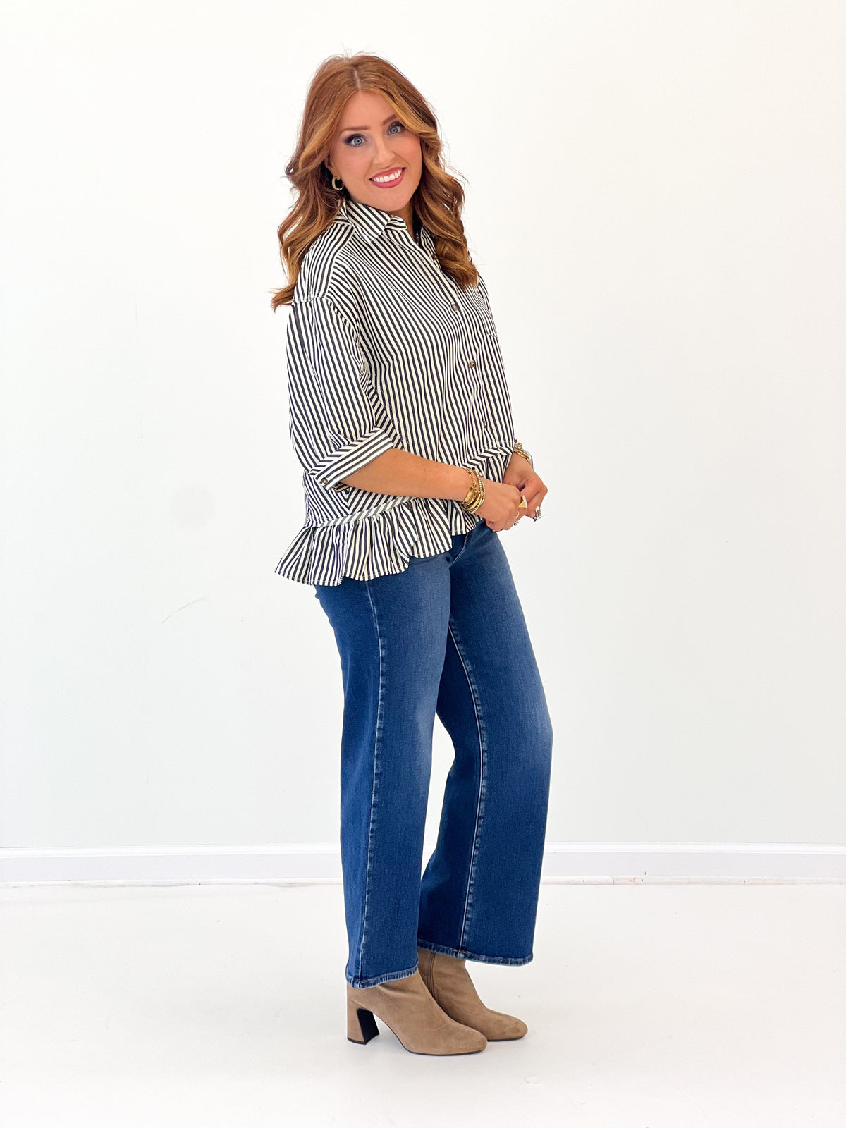 Striped peplum blouse with peplum ruffle at waist and buttoned collar