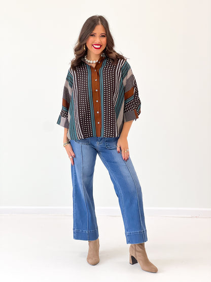 Front view of brown patterned stripe shirt with collar and button front, short sleeves