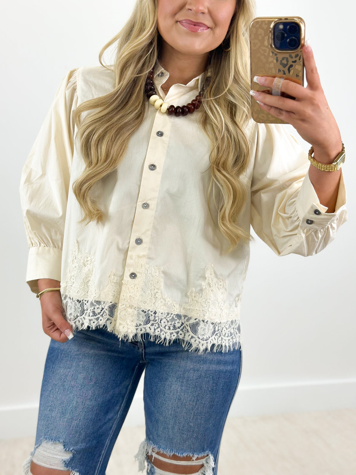 Ecru lace-trim button-down blouse with puff sleeves and small front buttons