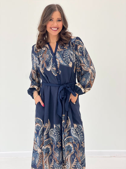 Navy long-sleeve dress with abstract paisley print, V-neck, tie belt waist