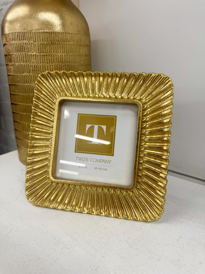Gold photo frame with scalloped plume textured border and centered monogram T display