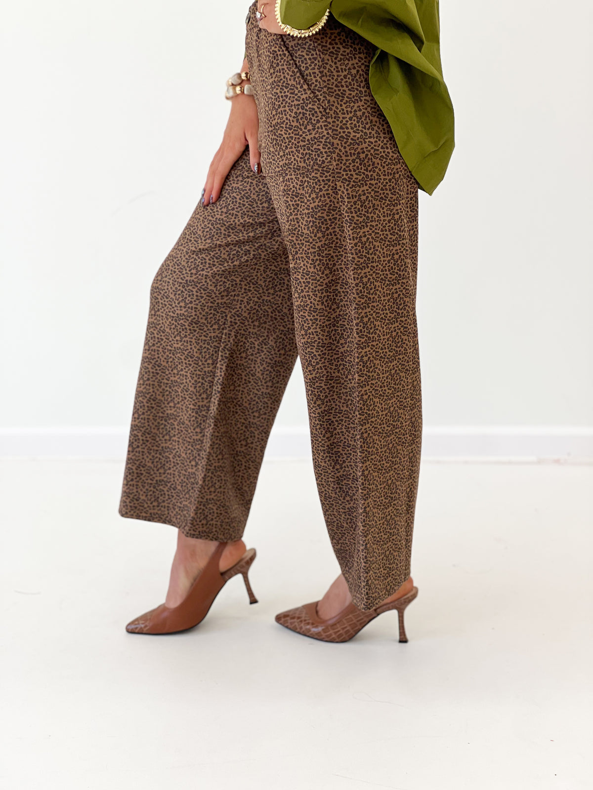 Camel leopard print wide-leg pants, draped front and side view