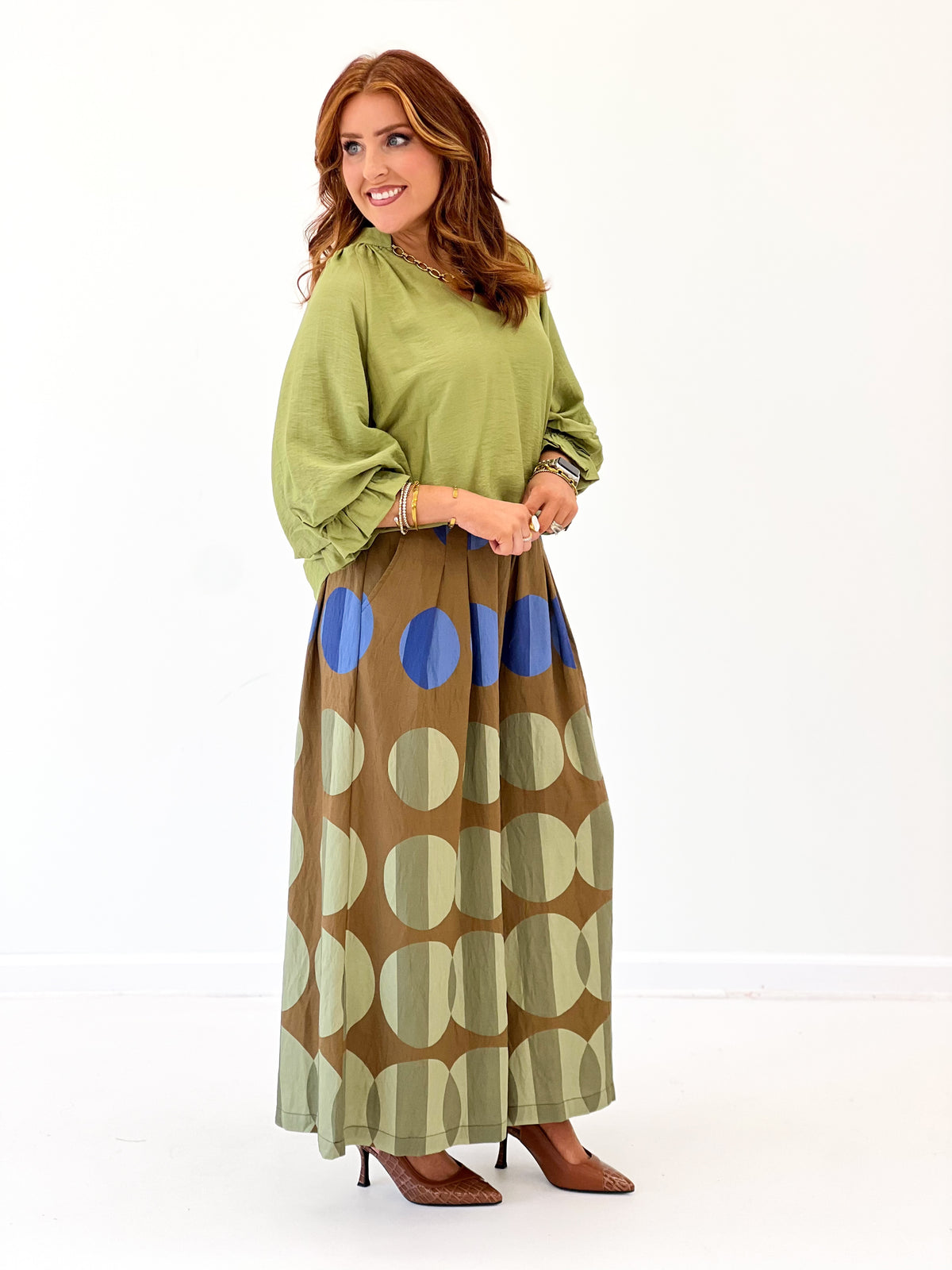 Wide-leg printed pants with large olive, tan, and blue circles, pull-on style