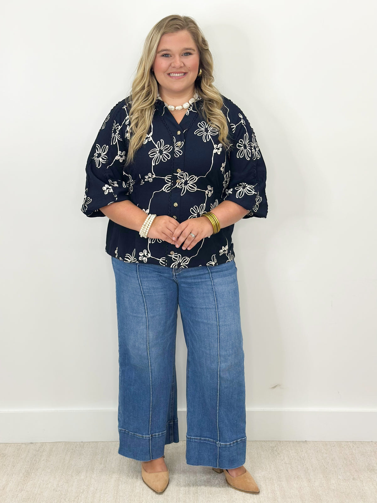 Navy floral printed button-detail top, half sleeves, front button accents