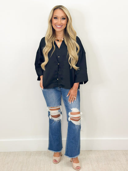 Black V-neck button-down shirt with metal buttons, 3/4-length sleeves