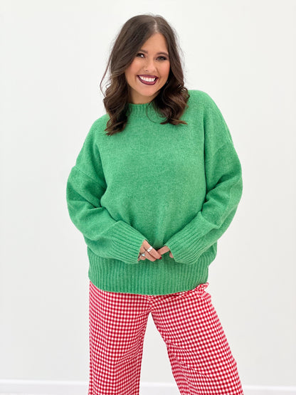 Green ribbed crew neck sweater with relaxed fit and ribbed hem