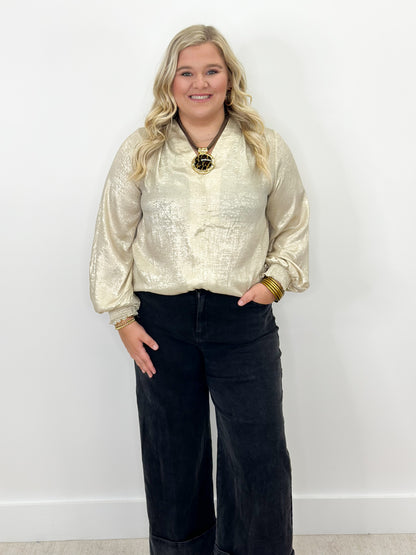 Shimmer gold V-neck top with ruched sleeve cuffs
