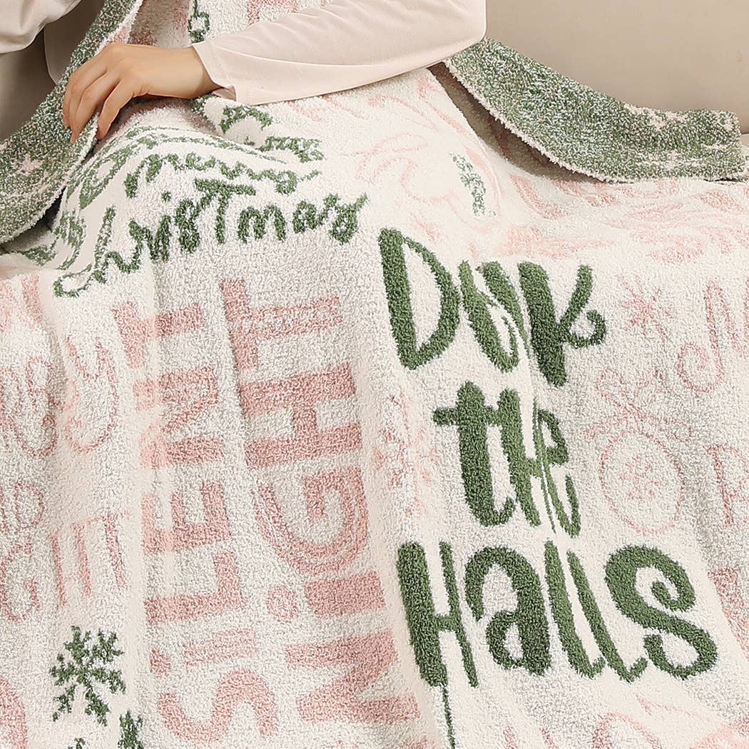 Cream throw blanket with pink and green Holly Jolly print