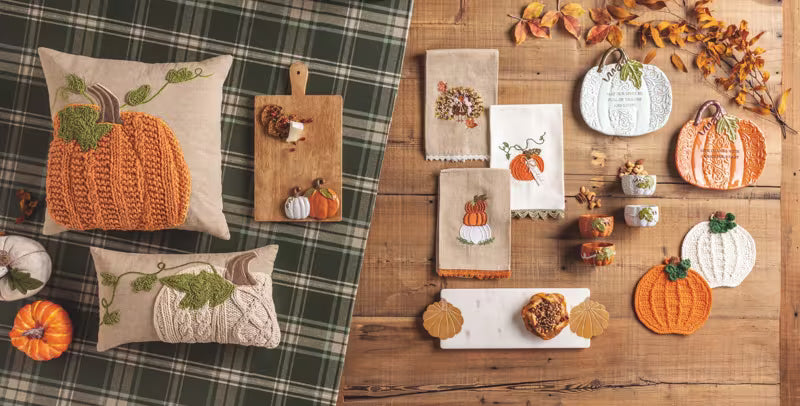 Square pumpkin vine throw pillows with orange knitted pumpkins and green vine embroidery