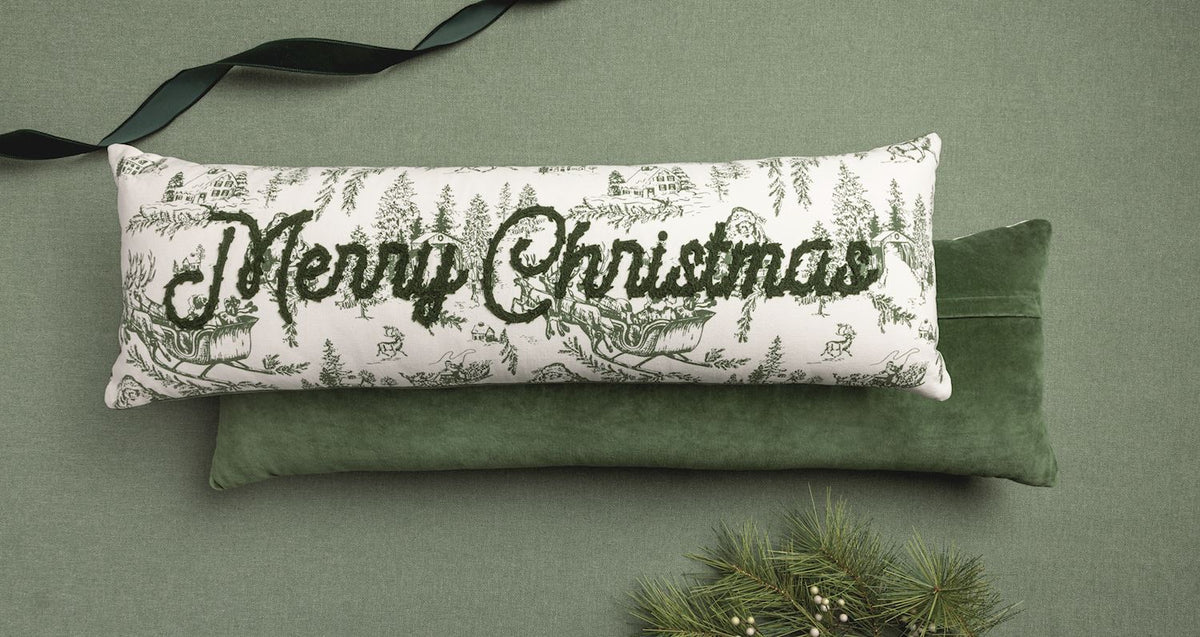 MudPie Merry Christmas Toile Long Pillow styled