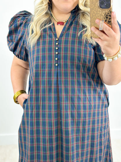 Plaid midi dress in navy and rust with puff sleeves and ruffled V-neck