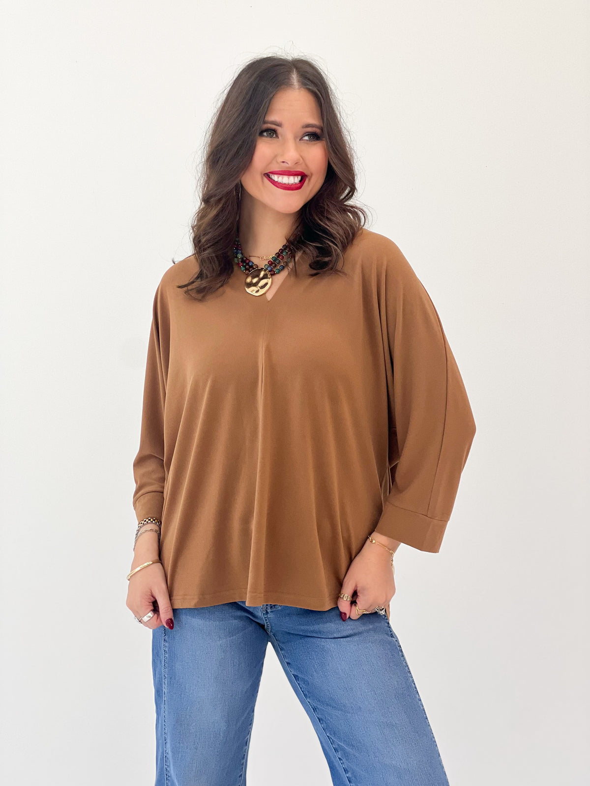 V-neck quarter-sleeve top in toffee brown with loose fit and V-neck opening