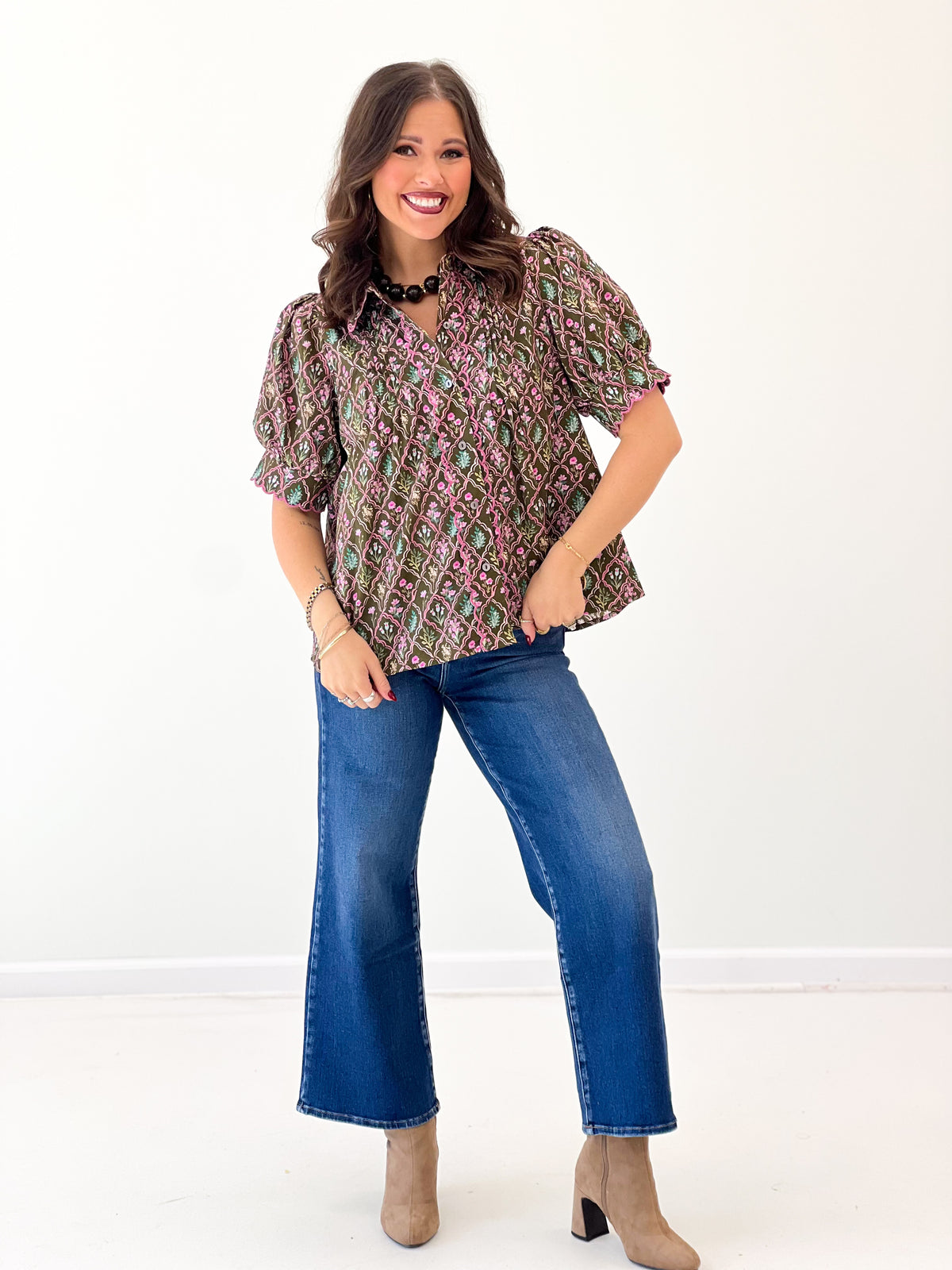 Floral pintuck puff-sleeve top with V-neck and short, ruffled sleeve edges