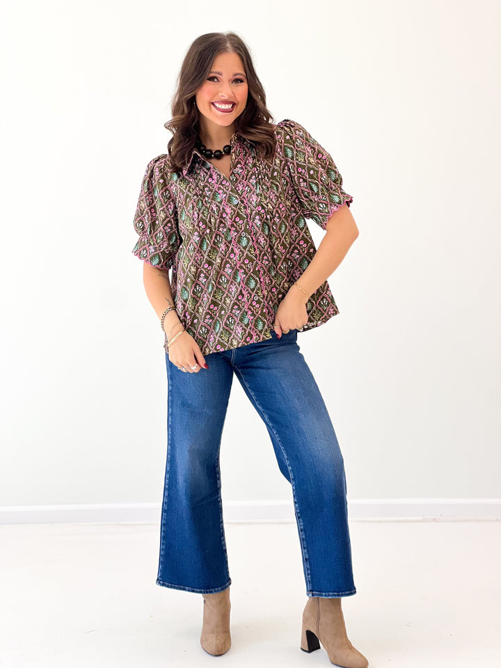 Floral pintuck puff-sleeve top with V-neck and short, ruffled sleeve edges