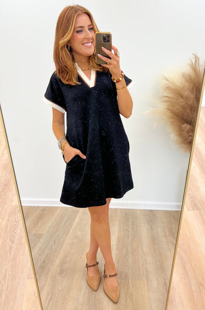 V-neck collared dress with white trim, short sleeves, dark speckled fabric