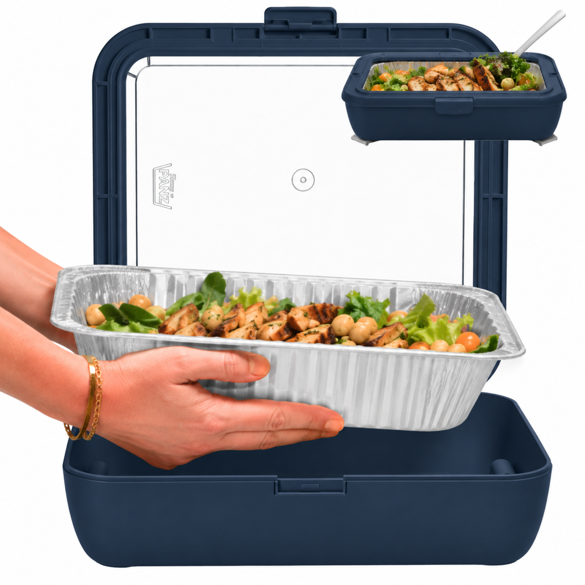 Navy foil pan carrier with clear foil insert and serving spoon, held in a hand