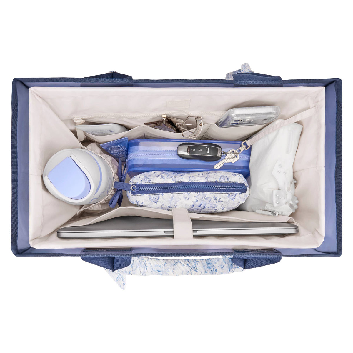 Cream organizer insert with open top, internal dividers, and a central zippered pocket