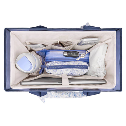 Cream organizer insert with open top, internal dividers, and a central zippered pocket