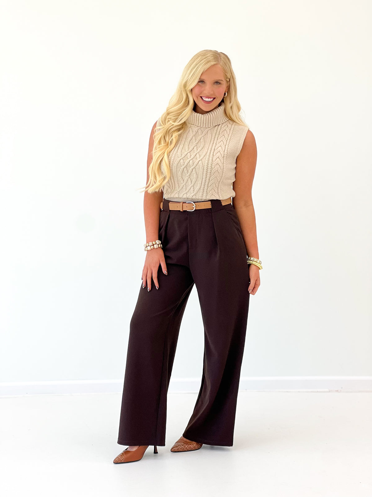 Dark brown belted pleated wide-leg pants with high waist and straight wide legs