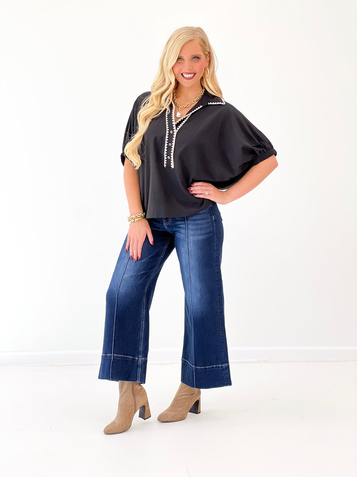 Black V-neck scrunch sleeve top with contrast front trim, relaxed silhouette