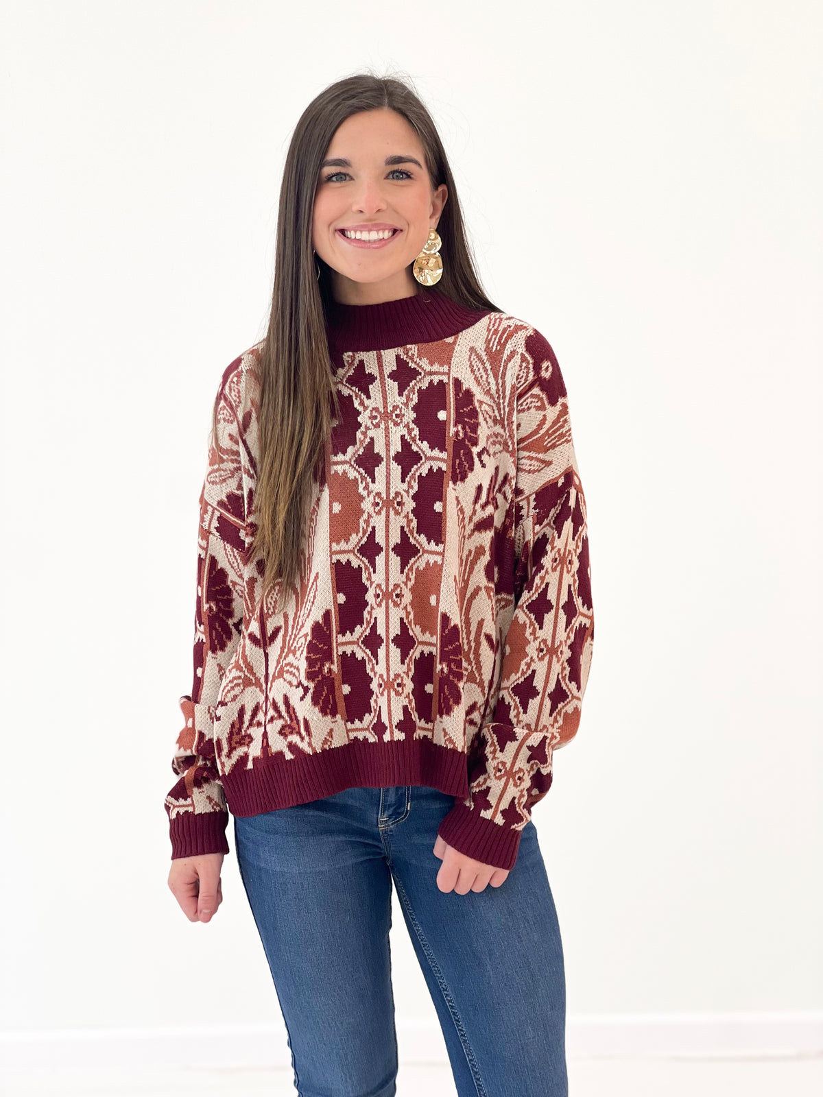 Wine tapestry knit sweater with ribbed crew neck and long sleeves