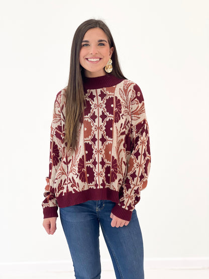 Wine tapestry knit sweater with ribbed crew neck and long sleeves