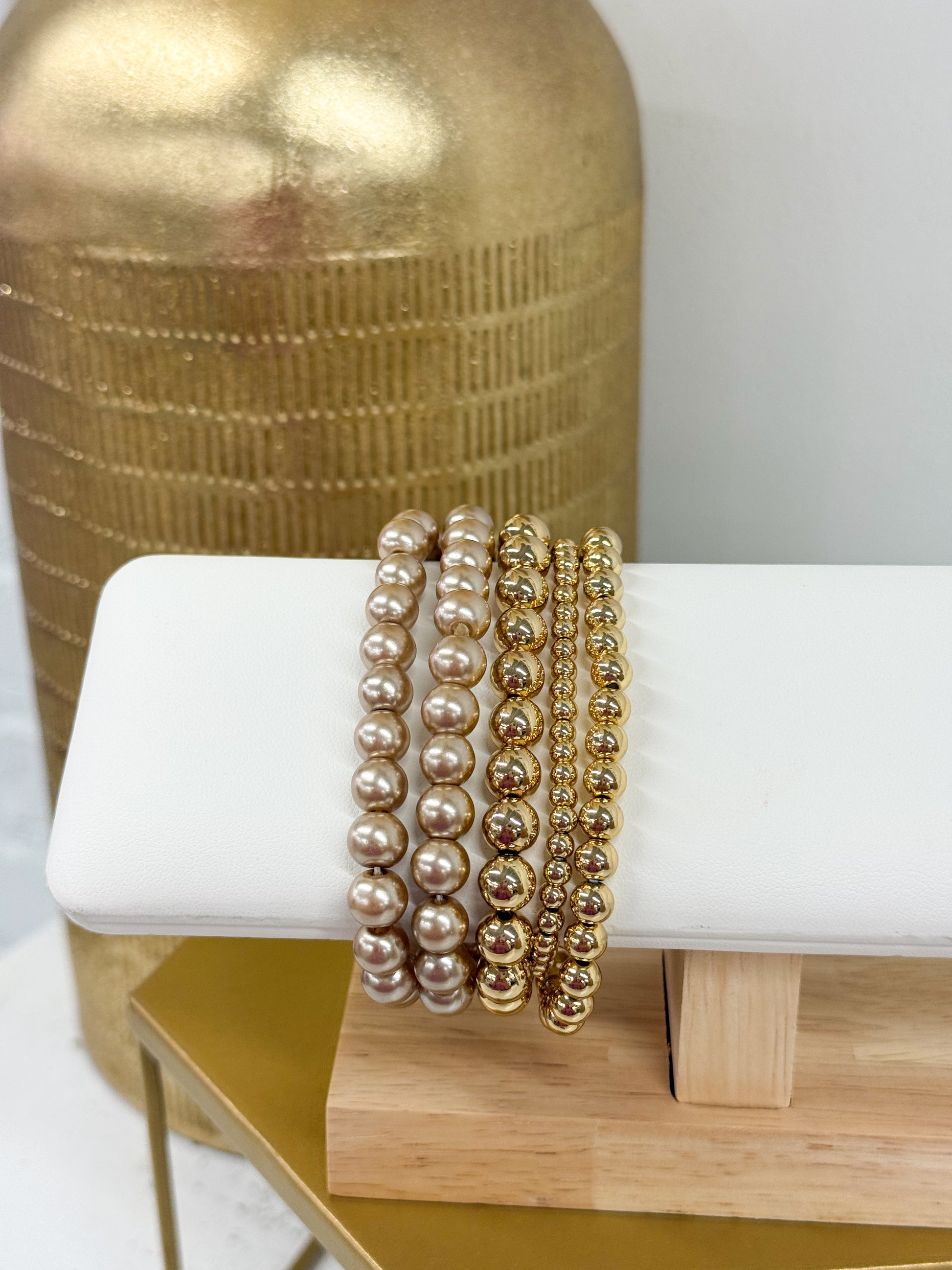 Gold-toned 5-row pearl and bead bracelet with stacked round strands