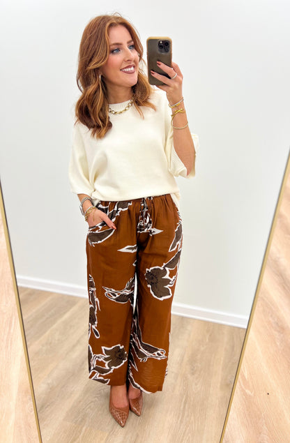 Ivory dolman elbow-sleeve sweater with wide neckline and rib hem
