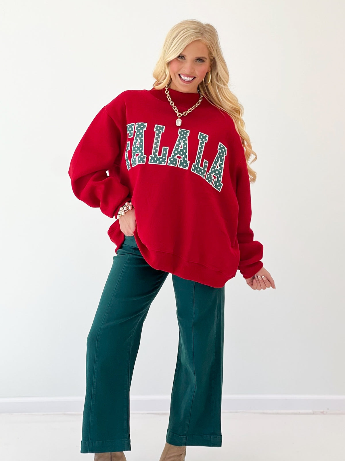 Red mock-neck sweatshirt with 'FALALA' polka-dot applique and relaxed fit