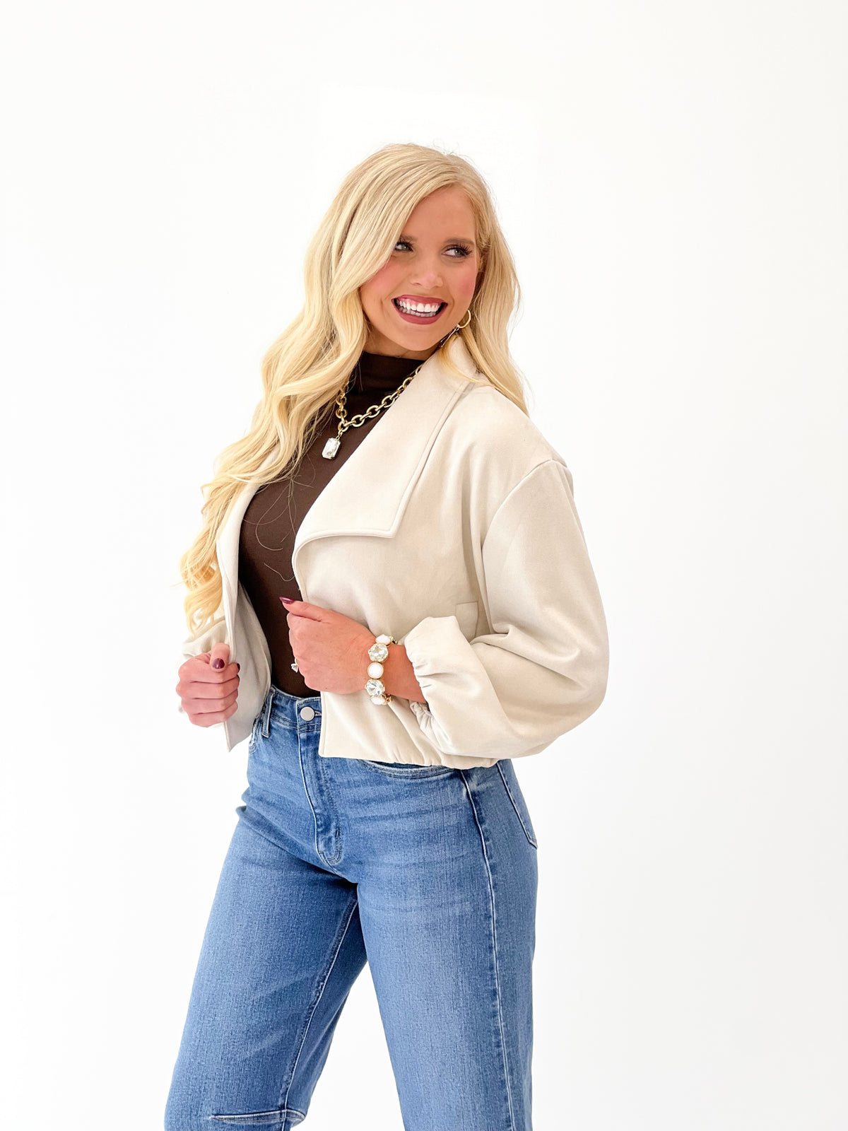 Bone suede open-lapel bubble jacket with open front, long sleeves, and patch pockets
