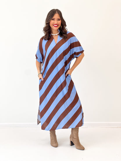 Light blue and rust striped dolman sleeve V-neck midi dress, standing pose
