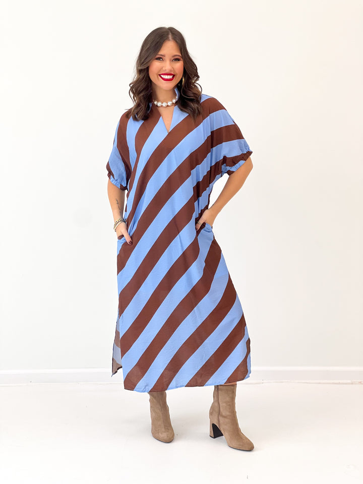 Light blue and rust striped dolman sleeve V-neck midi dress, standing pose