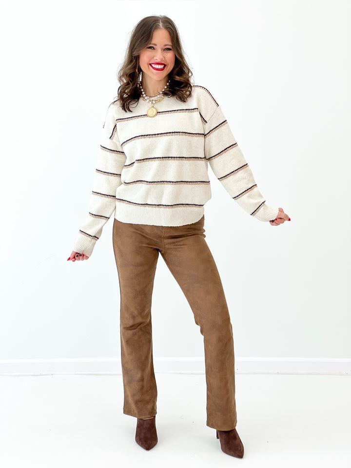 Oatmeal knit stripe pullover with crew neck and long sleeves, ribbed waist