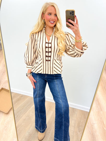 Brown-and-cream striped puff-sleeve blouse with decorative front lace-up design