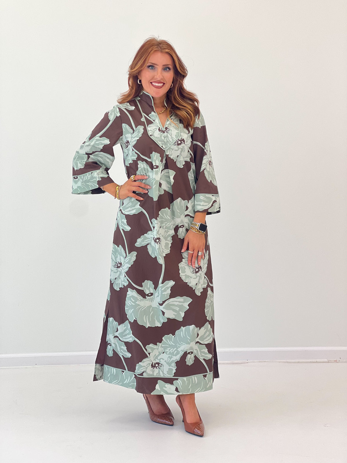 Chocolate-brown V-neck floral midi dress with mint flower pattern and long cuffed sleeves