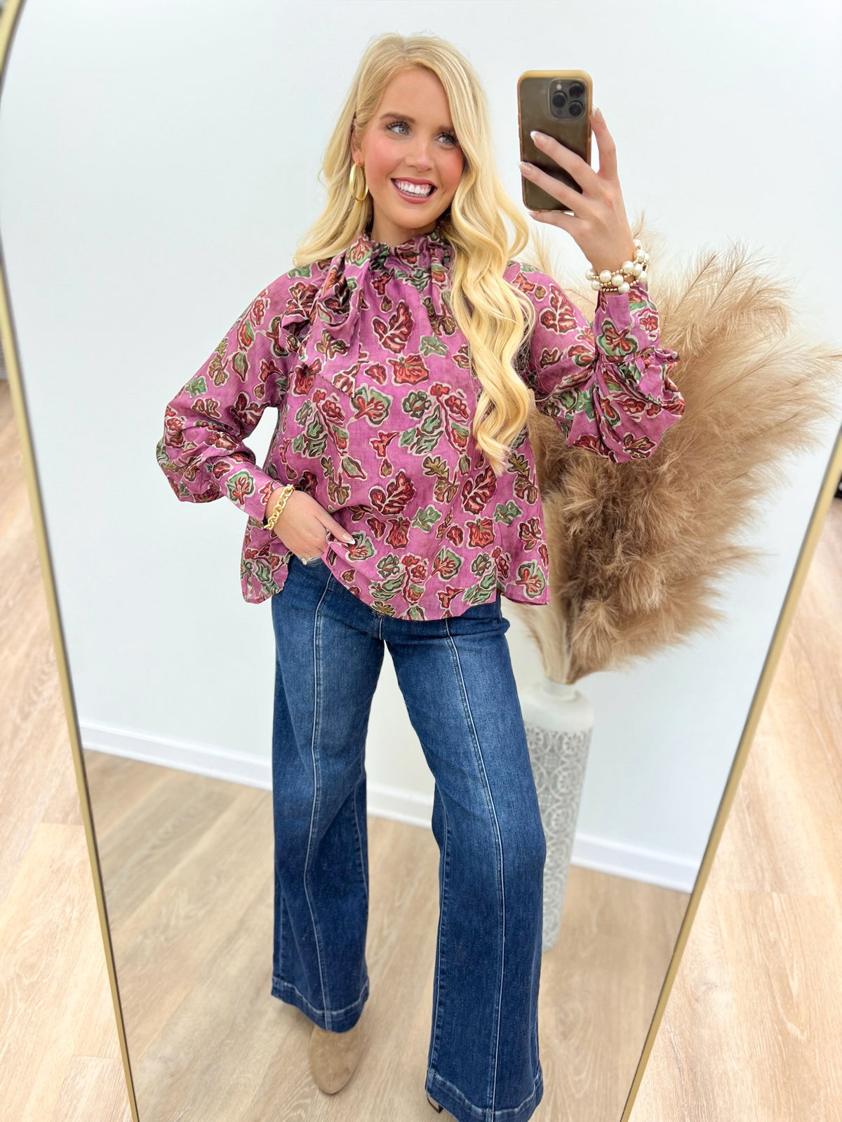 Pink ruffle tie-neck printed blouse with long sleeves