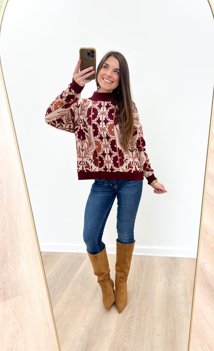 Wine knit sweater with tapestry floral motif, crew neck, long sleeves, ribbed cuffs