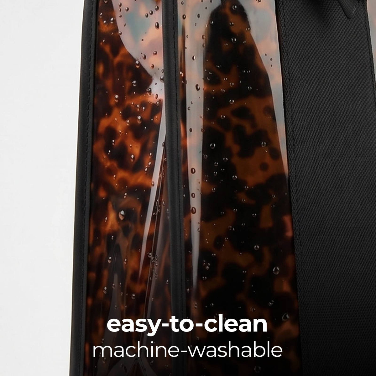 Tortoiseshell jelly tote with clear side panels and black trim, machine-washable